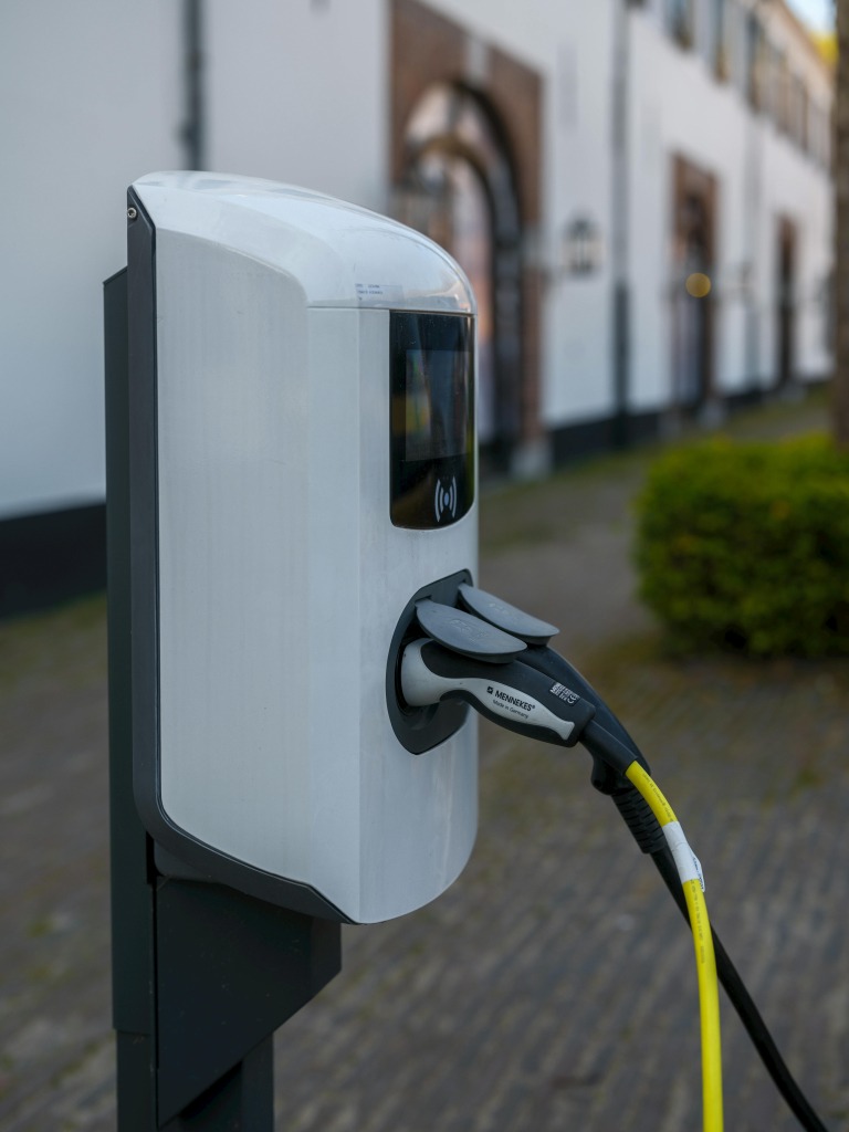 Electric vehicle charging outside a property